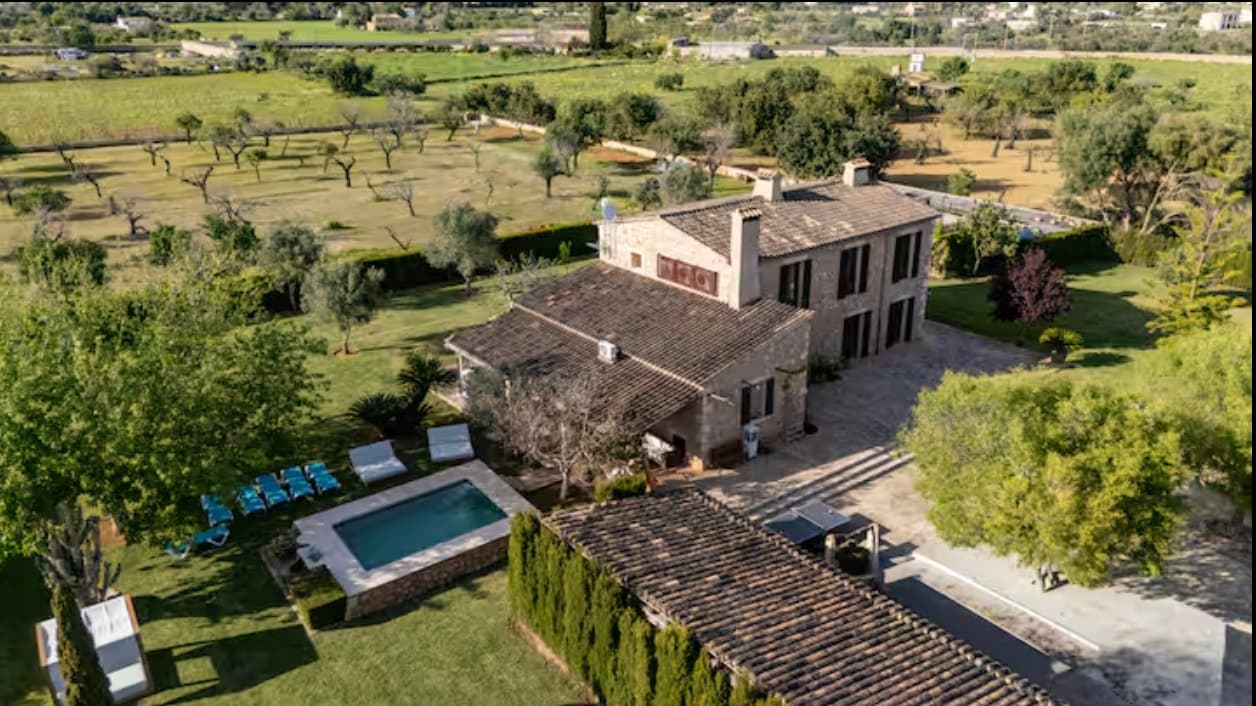 Aerial view of the finca in Binissalem, with its pool and olive groves